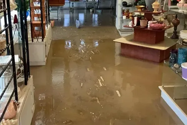 Floodwater spread across the floor of a retail shop